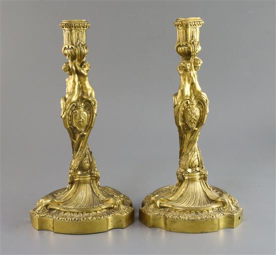 A pair Louis XVI ormolu candlesticks, height 12in.